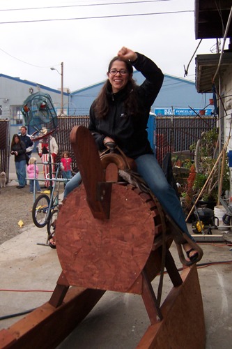 [Melissa on the giant rocking horse at the Life Size Mouse Trap]
